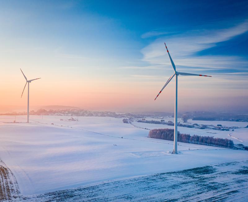 Wind turbines in winter field