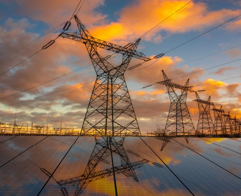 High voltage electricity pylons and solar panels