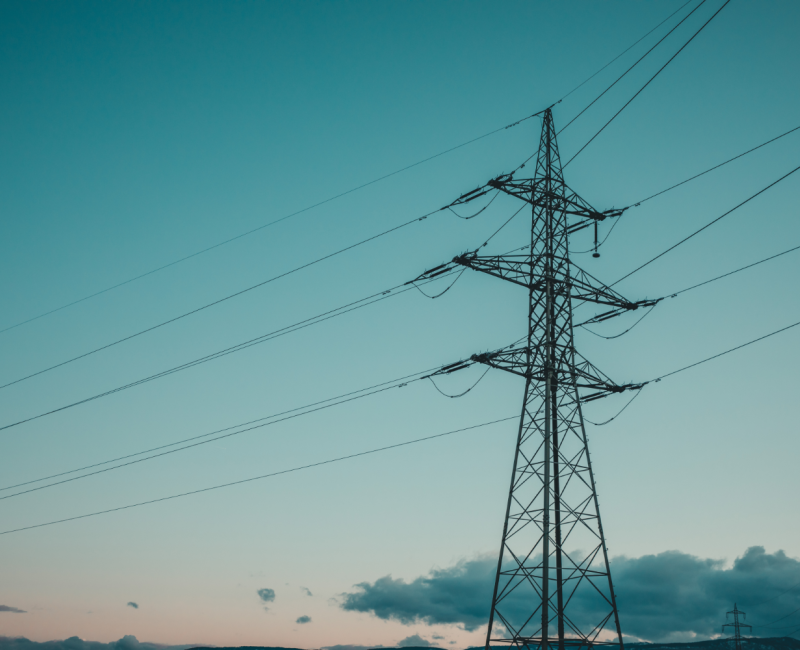 Electricity transmission line against a blue sky